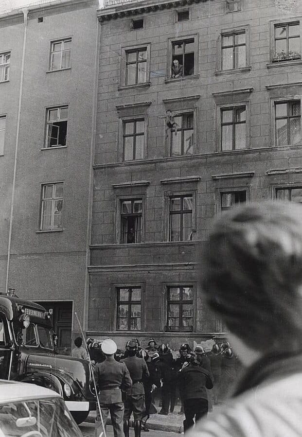 October 7, 1961 — Willy Finder tosses his 4-year-old son Michael over the Berlin Wall into a net held by West Berliners before jumping himself. Photo: The Central Intelligence Agency | Wikipedia