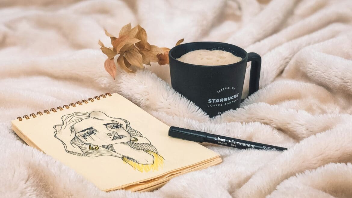 Sketch on journal and a pen, representing as a tool for processing grief and practicing forgiveness.