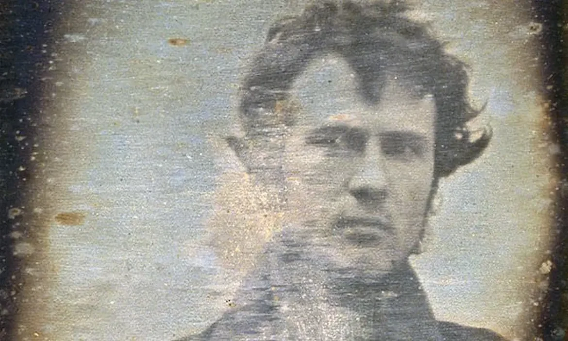 Black and white daguerreotype self-portrait of Robert Cornelius, considered the first selfie in history, taken in 1839.