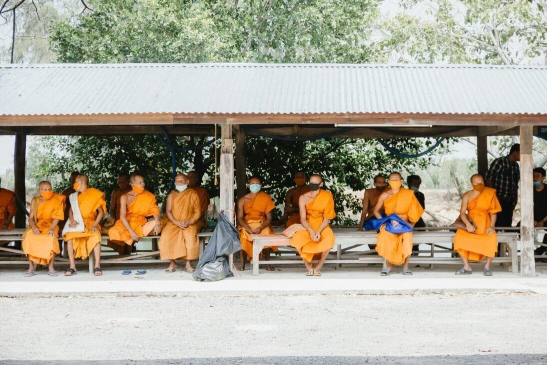 Monks receiving alms during sunrise in Luang Prabang a hidden gems