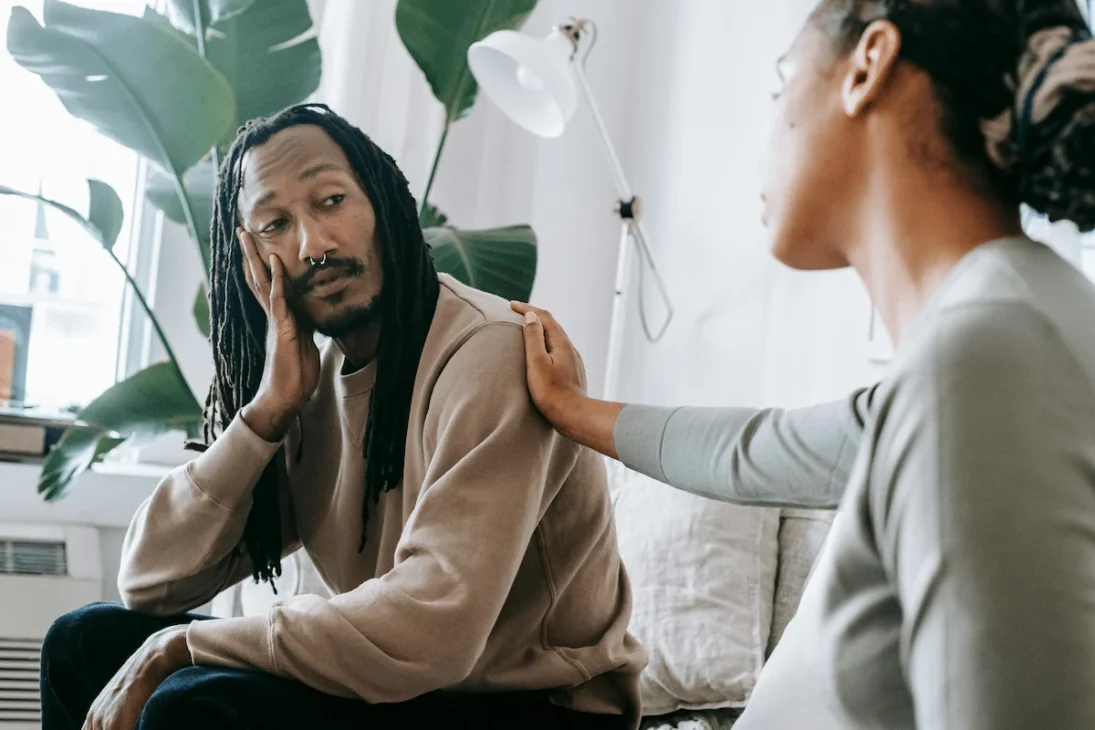 Illustration of a man talking to a woman, symbolizing the concept of asking for help and open communication.