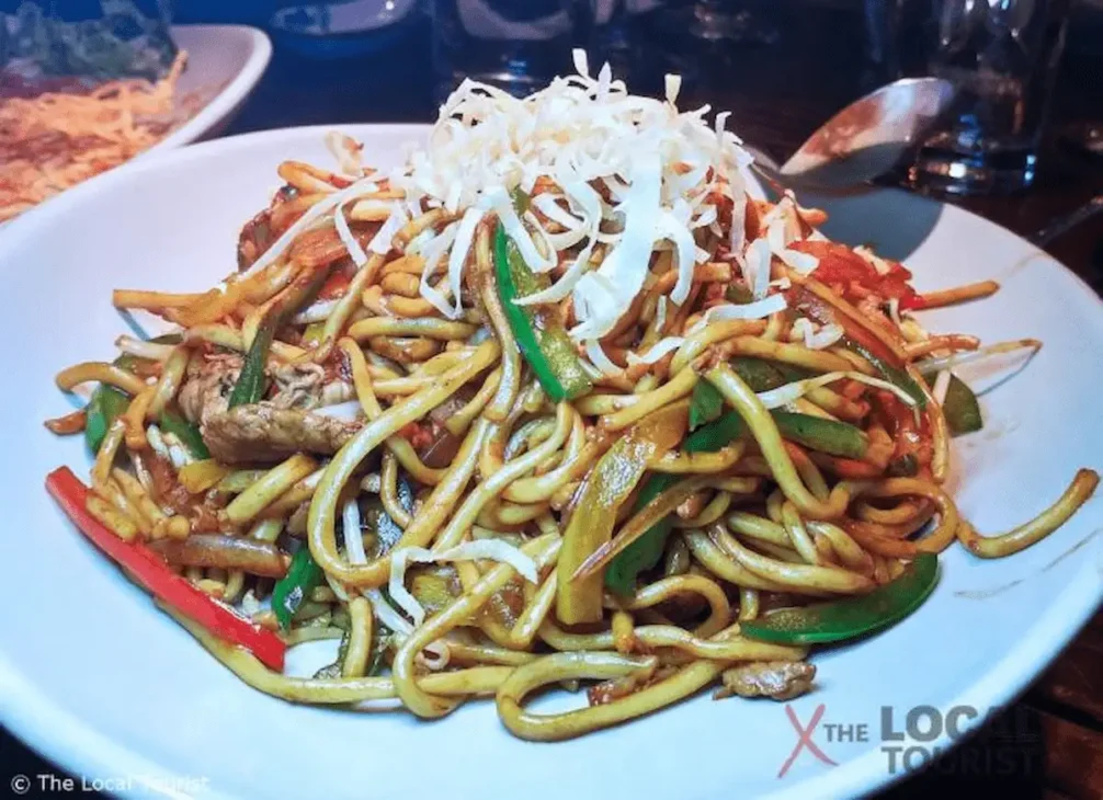 Hand-pulled lamian noodles made from millet flour, inspired by the 4,000-year-old recipe discovered in northwest China.
