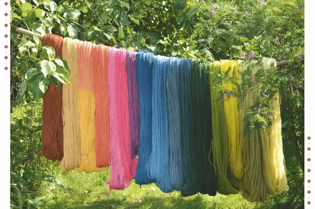 Colorful yarns hanging outside, representing the historical and cultural significance of colors.