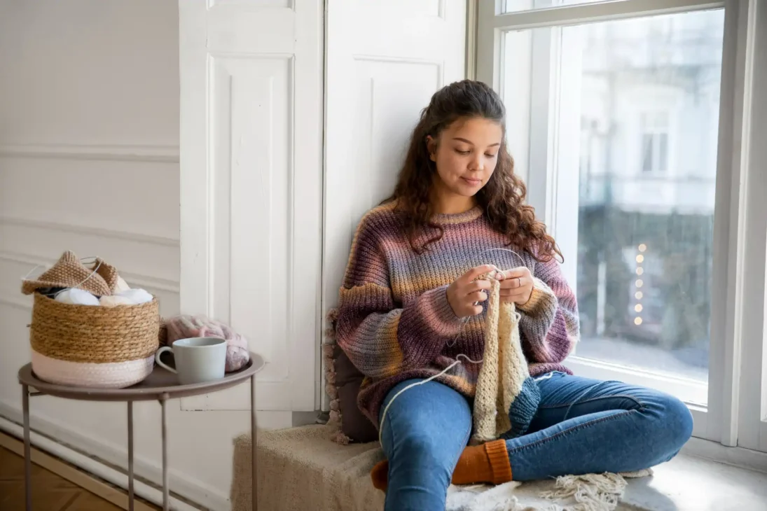Knitting as an adult hobby idea for mindfulness, relaxation, and stress relief.