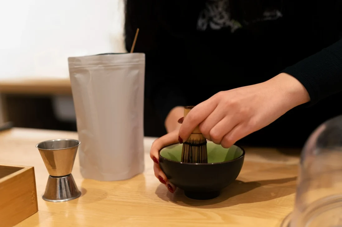 Matcha whisking setup on a kitchen counter for a modern tea ritual and matcha tea benefits