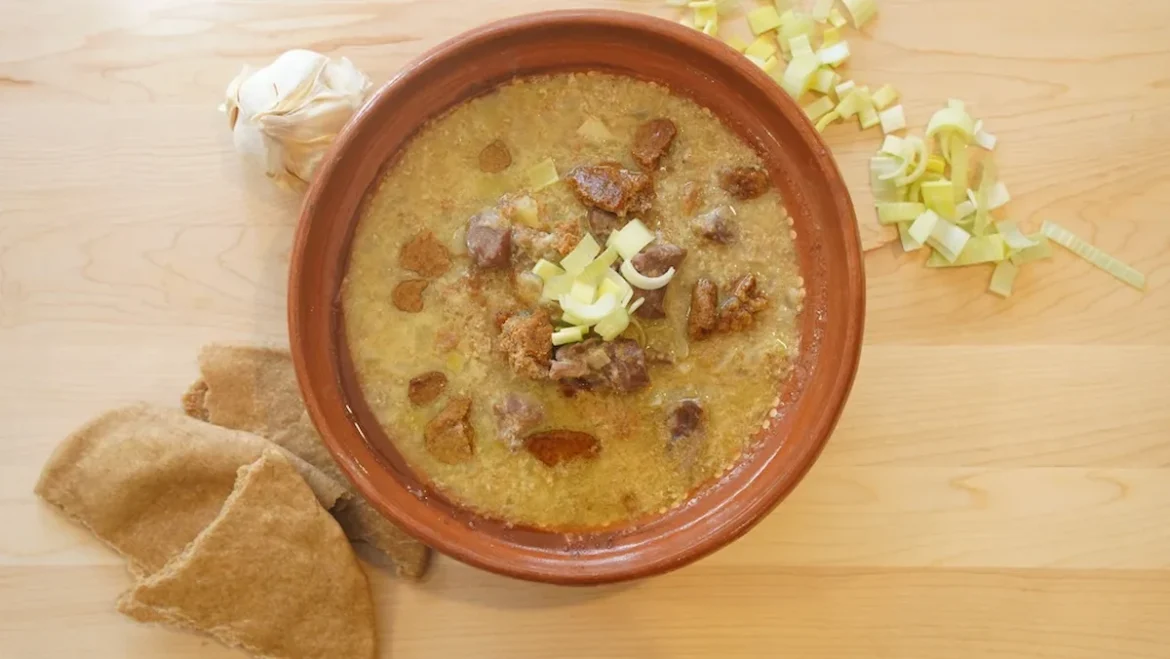 Ancient Mesopotamian lamb stew with onions, leeks, garlic, and barley flatbread crumbs, inspired by a 4,000-year-old recipe.