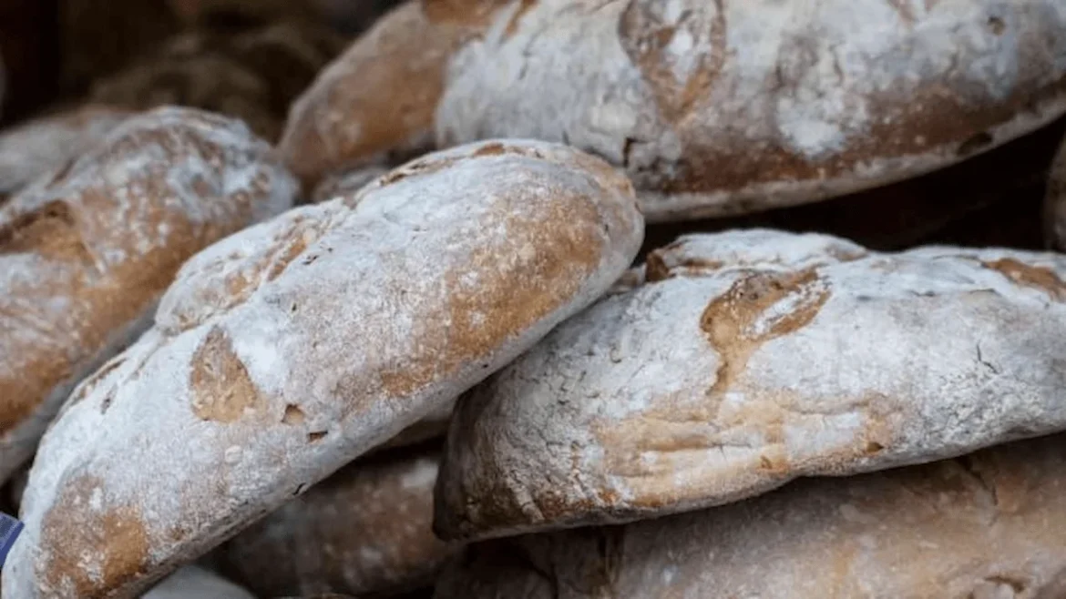 Traditional Egyptian aish baladi bread, round loaves baked in hot ovens, continuing a 6,000-year-old tradition.