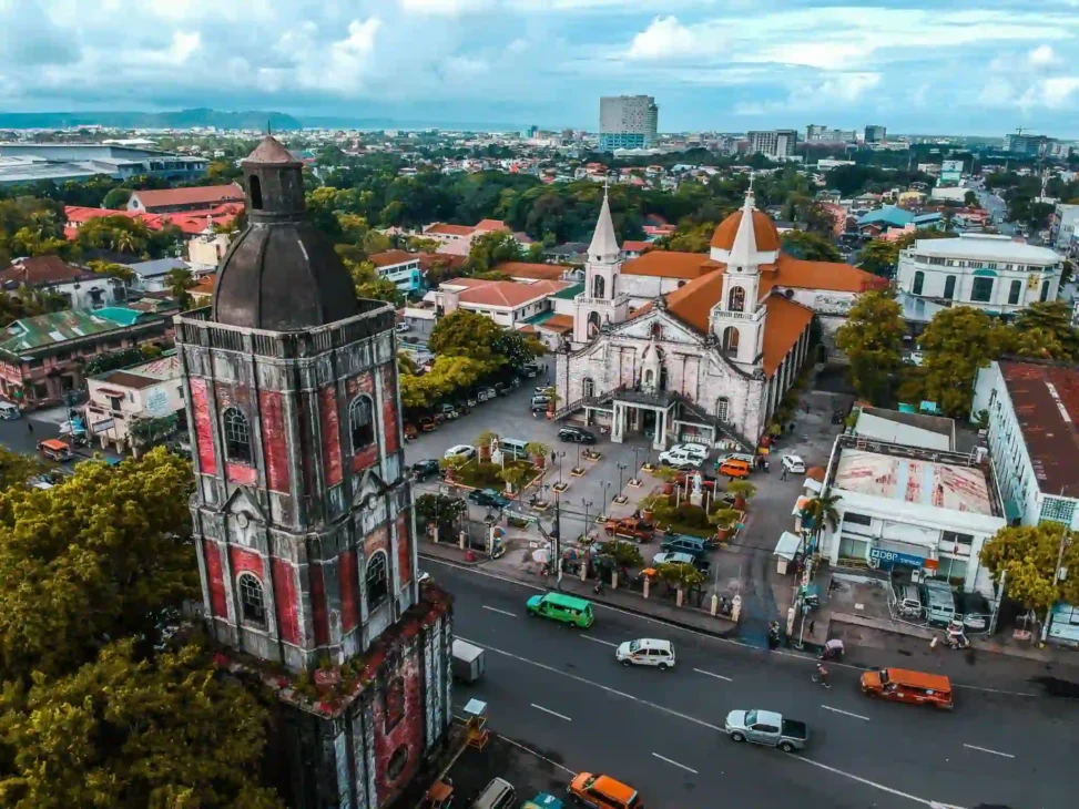 Aerial view of Jaro Cathedral and Bell Fray Tower in Iloilo – iconic landmarks for cultural urban exploration and staycation ideas.