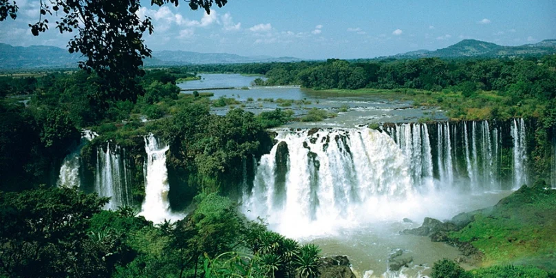 Blue Nile Falls (Tis Issat) near Lake Tana, Ethiopia, with water plunging dramatically and mist rising, showcasing one of the region’s most iconic natural landmarks.
