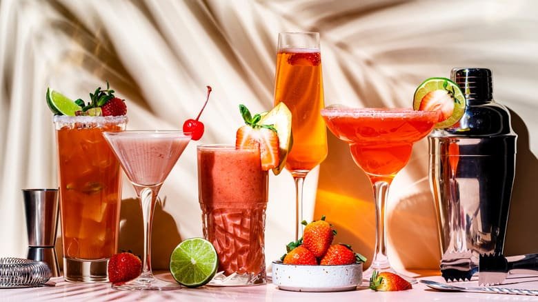 A colorful lineup of non-alcoholic cocktails and mocktails on a table, showcasing the rise of sober-curious nightlife trends.