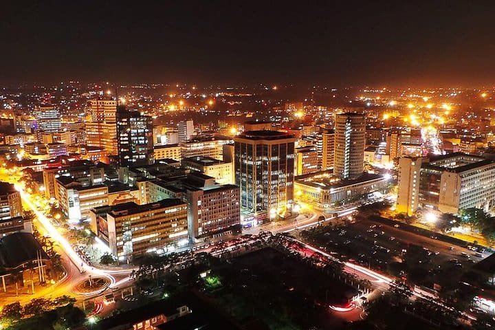 Nairobi at night highlighting key nightlife neighborhoods like Westlands, Kilimani, Karen, Ngong Road, and CBD, showing popular bars, clubs, and lounges with glowing icons.
