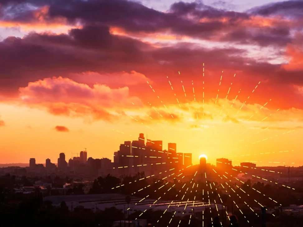 Sunrise over a city skyline with warm morning light spreading across buildings, symbolizing circadian reset and recovery from burnout after time zone travel.