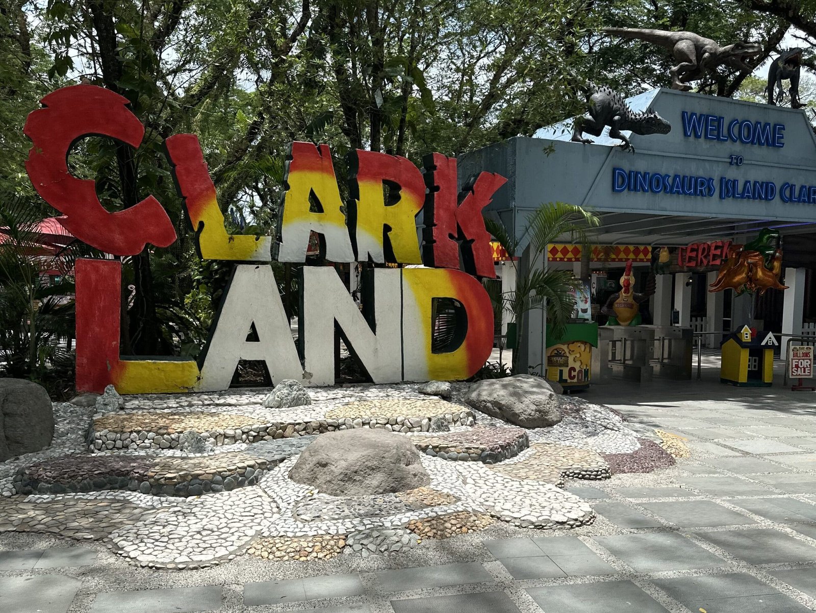 Front view of life-sized dinosaur displays at Dinosaur Island, Clark Freeport Zone, Pampanga, Philippines.