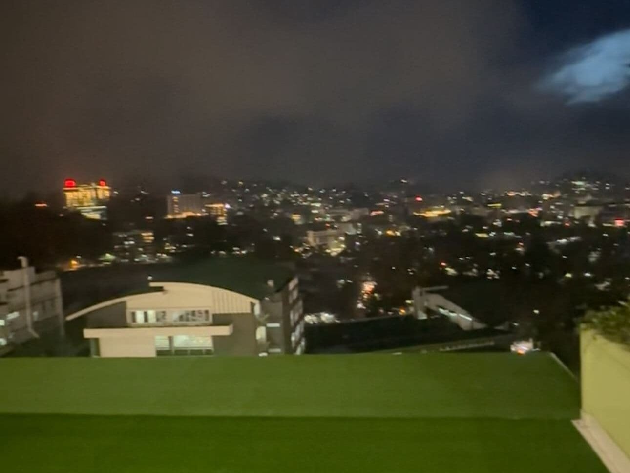 Stunning night lights of Baguio City viewed from SM City Baguio, showing illuminated streets and buildings