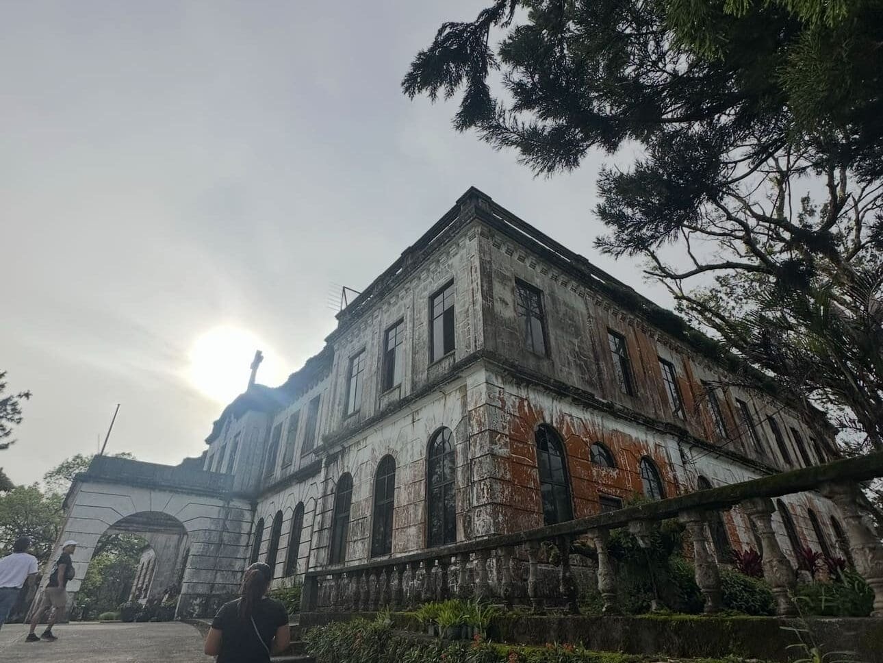 Old Diplomat Hotel ruins on Heritage Hill in Baguio City with weathered walls and overlooking city views