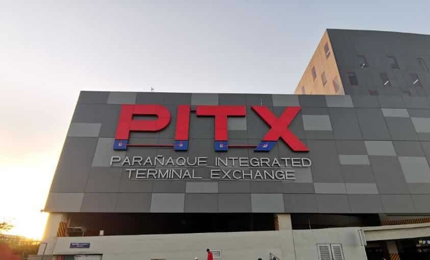Parañaque Integrated Terminal Exchange (PITX) showing modern bus terminal with shops, waiting areas, and transportation options.